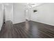Neutral bedroom featuring hardwood floors, a ceiling fan, and lots of natural light at 837 Dolphin Nw Ave, Port Charlotte, FL 33948