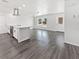Bright open-concept kitchen with white cabinets, stainless appliances, and ample counter space at 837 Dolphin Nw Ave, Port Charlotte, FL 33948