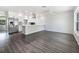 Open-concept living area with wood floors, seamlessly connected to a stylish kitchen at 837 Dolphin Nw Ave, Port Charlotte, FL 33948