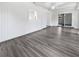 Bright living room with hardwood floors, white walls, and decorative white trim at 837 Dolphin Nw Ave, Port Charlotte, FL 33948