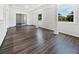 Living Room featuring wood floors, recessed lighting, white walls and window views at 837 Dolphin Nw Ave, Port Charlotte, FL 33948