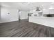 Spacious open-plan room with stylish kitchen and ample natural light from multiple windows at 837 Dolphin Nw Ave, Port Charlotte, FL 33948