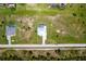 Aerial view of a home with a pool and manicured lawn, highlighting its location in a quiet neighborhood at 261 Rotonda S Blvd, Rotonda West, FL 33947
