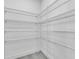 Walk in closet with metal storage shelves on the wall at 261 Rotonda S Blvd, Rotonda West, FL 33947