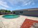 Backyard featuring a refreshing pool with patio space at 8253 Penwood Dr, Port Richey, FL 34668
