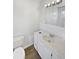 Bright bathroom features a vanity with speckled countertop at 8253 Penwood Dr, Port Richey, FL 34668