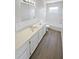 Modern bathroom with a white vanity, quartz countertops, and updated fixtures at 8253 Penwood Dr, Port Richey, FL 34668
