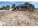 Charming home featuring unique architectural details and mature palm trees at 8253 Penwood Dr, Port Richey, FL 34668