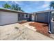 Charming single-Gathering home featuring a gray exterior and a well-manicured yard at 8253 Penwood Dr, Port Richey, FL 34668