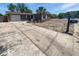 Charming single-story home featuring a gray exterior, well-maintained lawn, and a concrete driveway at 8253 Penwood Dr, Port Richey, FL 34668