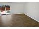 Living room featuring modern floors and a sliding glass door leading to a pool area at 8253 Penwood Dr, Port Richey, FL 34668