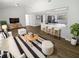 Bright, open-concept living room and kitchen featuring modern finishes and ample seating at 8253 Penwood Dr, Port Richey, FL 34668