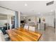 Open living space showcasing a dining area, kitchen island, and comfortable living room, perfect for gatherings at 17737 Canopy Pl, Bradenton, FL 34211