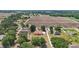 Aerial view of properties surrounded by trees and expansive farmland, providing a sense of rural living at 2202 Sparkman Rd, Plant City, FL 33566