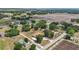 Expansive aerial view of homes surrounded by lush greenery and open fields at 2202 Sparkman Rd, Plant City, FL 33566