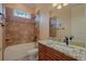 Bathroom featuring a bathtub and wood vanity at 2202 Sparkman Rd, Plant City, FL 33566