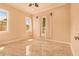 Bright bedroom with tile floor, three windows, and neutral walls at 2202 Sparkman Rd, Plant City, FL 33566
