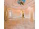 Large bedroom with ornate ceiling and tiled floors at 2202 Sparkman Rd, Plant City, FL 33566