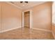 Bright bedroom with tile flooring, a ceiling fan, and a closet space at 2202 Sparkman Rd, Plant City, FL 33566