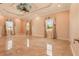 Large bedroom featuring elegant tray ceilings and tile floors at 2202 Sparkman Rd, Plant City, FL 33566