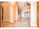 Elegant foyer with tile flooring, decorative ceilings, and seamless transition to other living areas at 2202 Sparkman Rd, Plant City, FL 33566