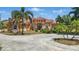 Stunning single-story home with a beautiful tile roof, a circular driveway, and lush landscaping at 2202 Sparkman Rd, Plant City, FL 33566