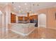 Beautiful kitchen with a large island, granite countertops, and custom wood cabinets at 2202 Sparkman Rd, Plant City, FL 33566