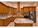 Well-equipped kitchen with stainless steel appliances, granite counters, and custom cabinets at 2202 Sparkman Rd, Plant City, FL 33566