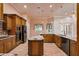 Spacious kitchen with stainless appliances, granite counters, custom cabinets, and kitchen island at 2202 Sparkman Rd, Plant City, FL 33566