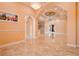 Spacious living room featuring tray ceilings, decorative ceiling fan, and lovely archways at 2202 Sparkman Rd, Plant City, FL 33566