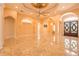 Spacious living room with a decorative ceiling, tile flooring, and arched doorways at 2202 Sparkman Rd, Plant City, FL 33566