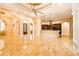 Spacious living room featuring gleaming tile floors and an open floor plan that flows into a modern kitchen at 2202 Sparkman Rd, Plant City, FL 33566