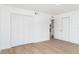 Spacious bedroom with a large closet and an open closet with shelves provides plenty of storage at 2239 Worrington St, Sarasota, FL 34231