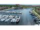 Aerial view of a marina filled with boats and yachts, surrounded by condos and waterfront properties at 25416 Jubal St, Punta Gorda, FL 33955