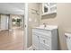 Well-lit bathroom vanity with modern sink, storage cabinet, and stylish fixtures at 5004 E Seneca Ave, Tampa, FL 33617