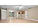 Bright and airy bedroom with mirrored closet doors, wood-look flooring, and plenty of natural light at 5004 E Seneca Ave, Tampa, FL 33617