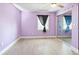 Inviting bedroom with wood-look flooring, ample natural light, and a mirrored closet at 5004 E Seneca Ave, Tampa, FL 33617