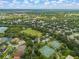 Panoramic aerial view of the community showcasing lush landscapes and recreational amenities including sport courts at 11818 Gilmerton Dr, Riverview, FL 33579