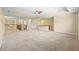 Spacious basement area with carpet, recessed lighting, wet bar, and stairs at 11818 Gilmerton Dr, Riverview, FL 33579