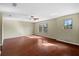 Bedroom with hardwood floors, a ceiling fan, and natural light at 11818 Gilmerton Dr, Riverview, FL 33579