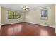 Bedroom with hardwood floors, a ceiling fan, and many windows at 11818 Gilmerton Dr, Riverview, FL 33579