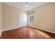 Bedroom with hardwood floors, a ceiling fan, a closet, and a window at 11818 Gilmerton Dr, Riverview, FL 33579