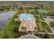 Aerial view of a community pool and recreation center, perfect for Gathering fun at 11818 Gilmerton Dr, Riverview, FL 33579