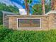 Stone monument with a sign that reads 'Panther Trace,' surrounded by green shrubbery at 11818 Gilmerton Dr, Riverview, FL 33579