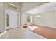 Inviting foyer boasts tile flooring, a decorative chandelier, and natural light at 11818 Gilmerton Dr, Riverview, FL 33579