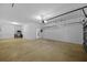 Spacious garage with epoxy flooring, garage door opener, and water heater at 11818 Gilmerton Dr, Riverview, FL 33579