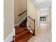 Hallway with staircase, tile flooring, and natural light at 11818 Gilmerton Dr, Riverview, FL 33579