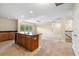 Open living space with island, carpeting, tile, and natural light at 11818 Gilmerton Dr, Riverview, FL 33579