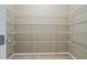 Walk-in pantry featuring wire shelving for organized storage, offering ample space for food and supplies at 11818 Gilmerton Dr, Riverview, FL 33579