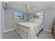 Bright bedroom featuring soothing neutral color scheme and plush rug at 70 Virginia Ct, Englewood, FL 34223